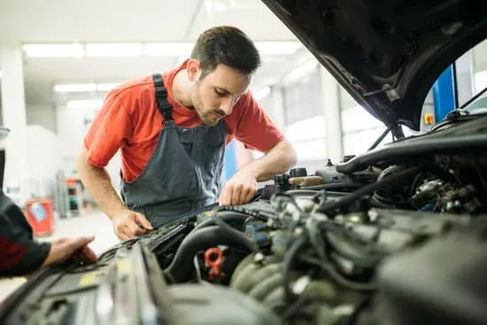 An ASE-certified mechanic performing engine diagnostics