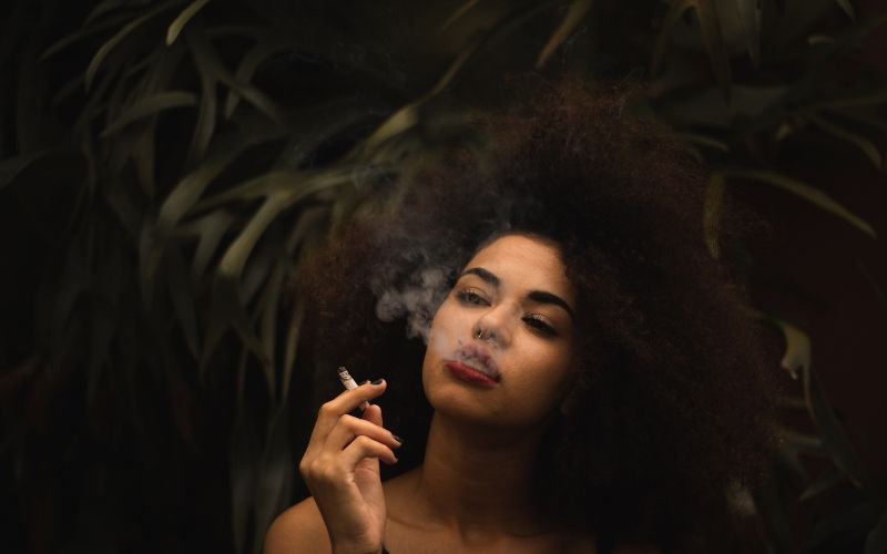 stylish woman smoking a cigarette